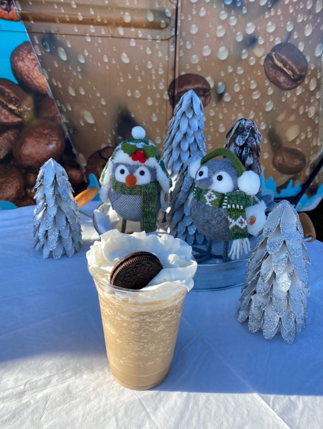 Cookie Frappe behind Christmas Decorations on the coffee truck